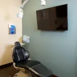 Examination room with dental chair and television