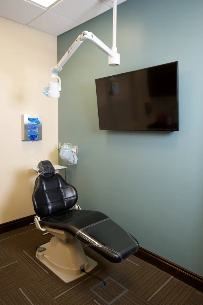 Examination room with dental chair and television